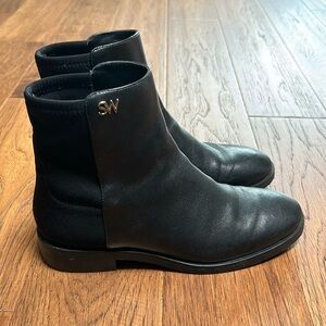 Lightly used Stuart Weitzman leather chelsea boots with fabric back.